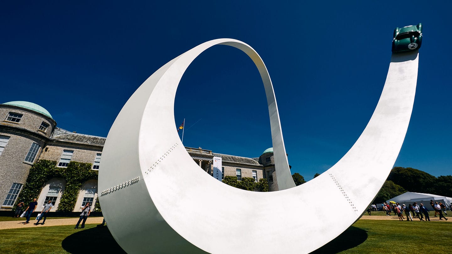 A sculpture of a car on a track