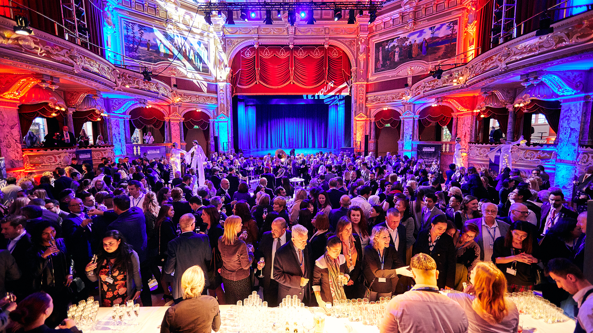 Attendees at an event in a theatre