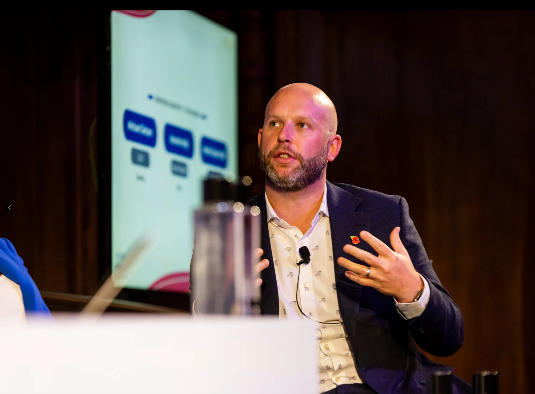 Michael speaking at a conference